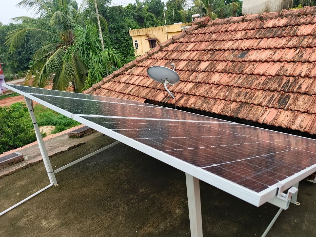 Technician performing routine maintenance on solar panels.